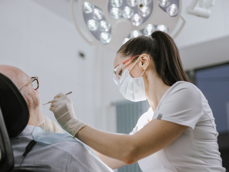 Dentist treating a patient at Hope Essence Dental Clinic